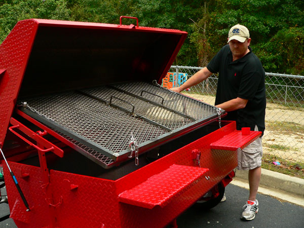 Flipping a pig or a grill full of chicken is easy with our Double Grate Turner.