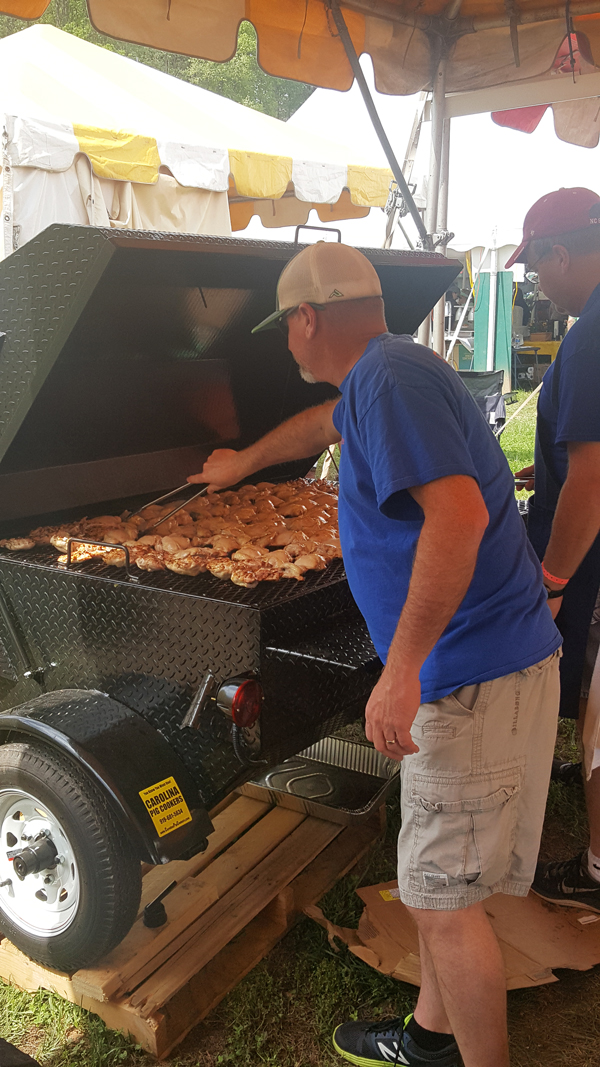 Merlefest, cooking on a Carolina Pig Cookers grill.