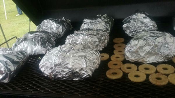 Pineapple slices and Boston Butts on the Carolina Pig Cookers grill.